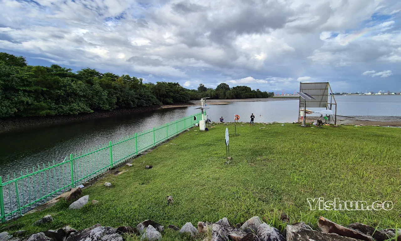 Discharge channel (left) releases water from Lower Seletar Reservoir into the Johor Straits Discharge channel (left) releases water from Lower Seletar Reservoir into the Johor Straits